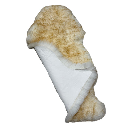 Brown-Tip New Zealand sheepskin folded to show natural leather underside
